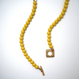 Collier de sucette jaune