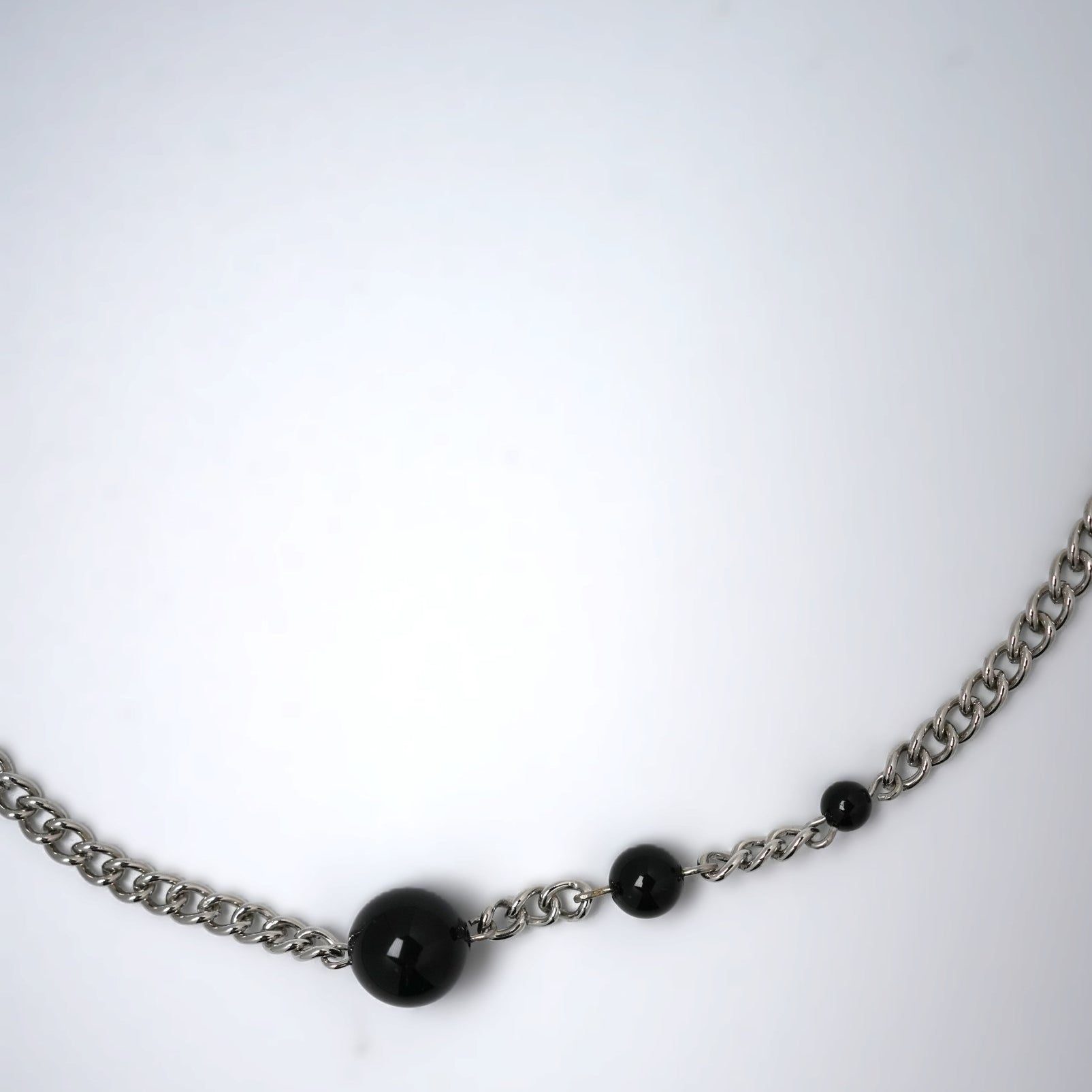 silver necklace wih three black agates