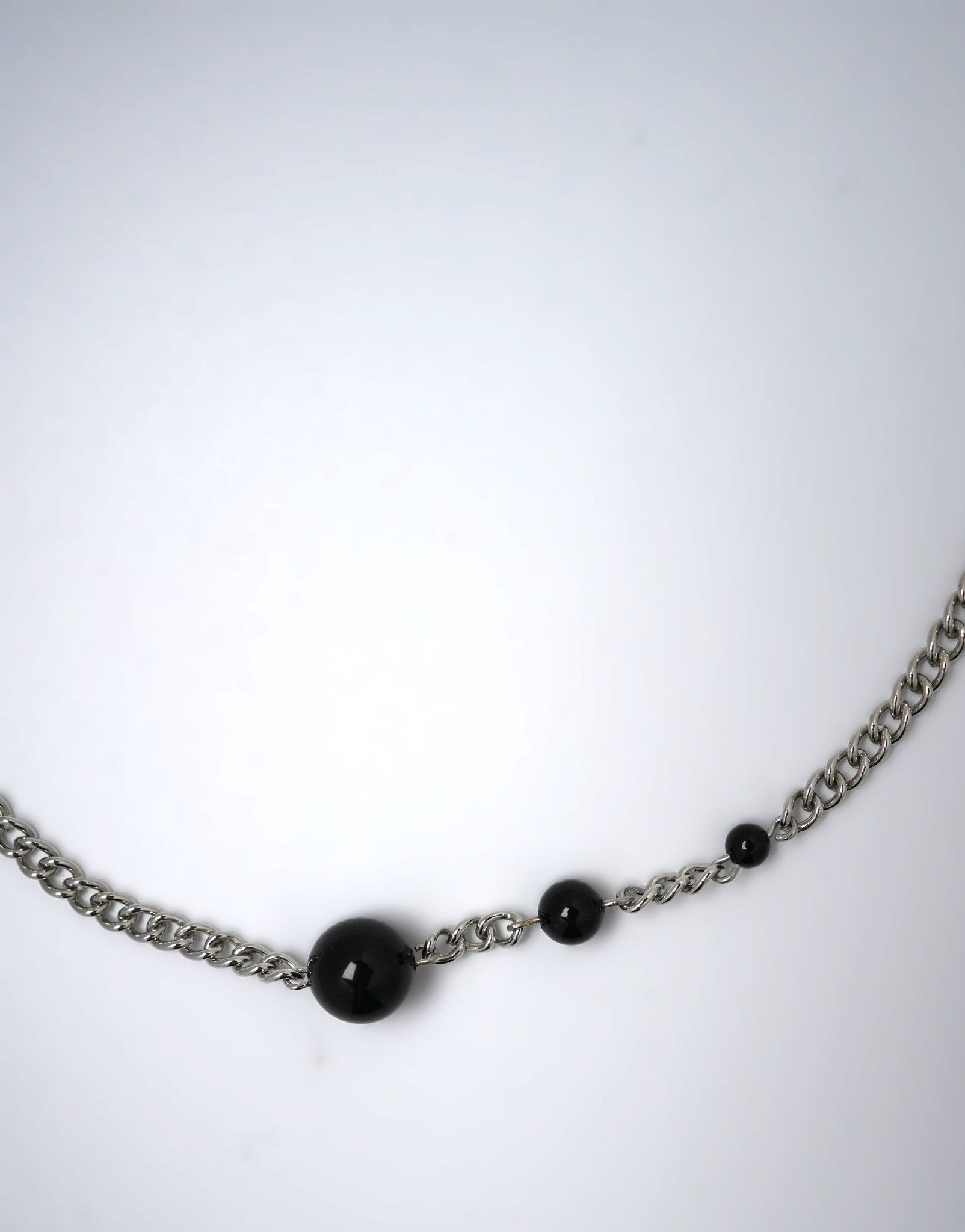 silver necklace wih three black agates